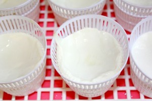 Ladle curds into baskets